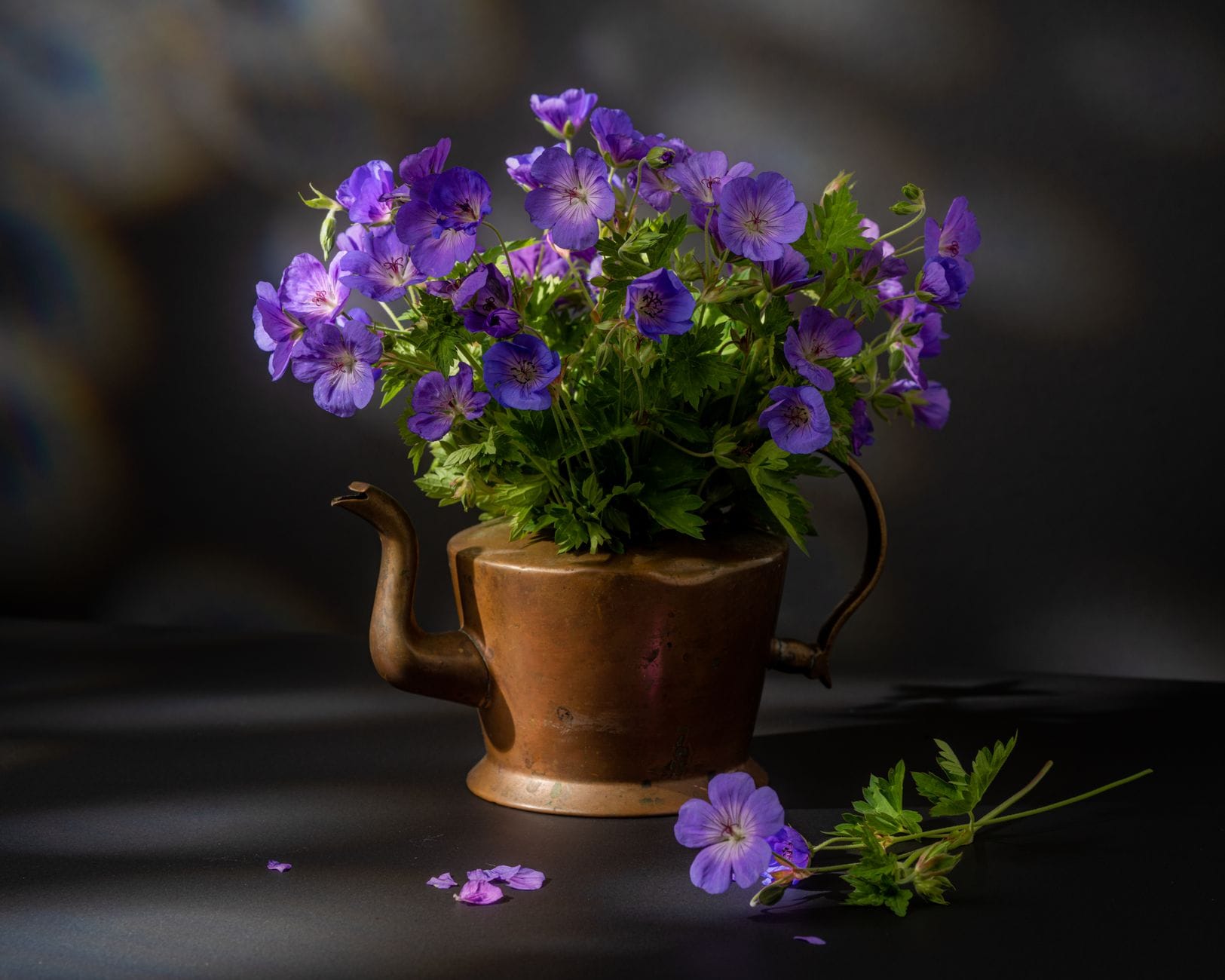 A copper jug of garden flowers