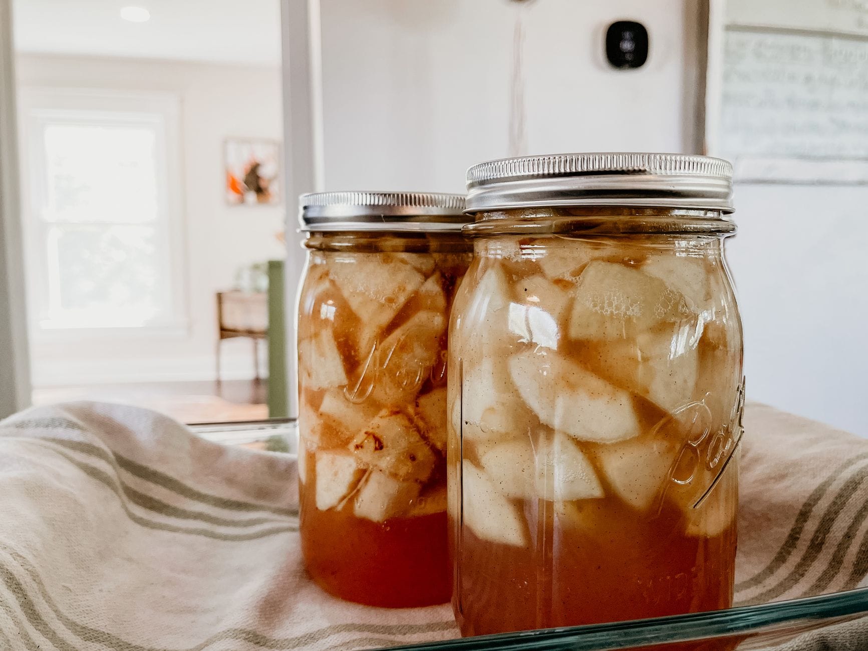 Jars of amber apple preserve