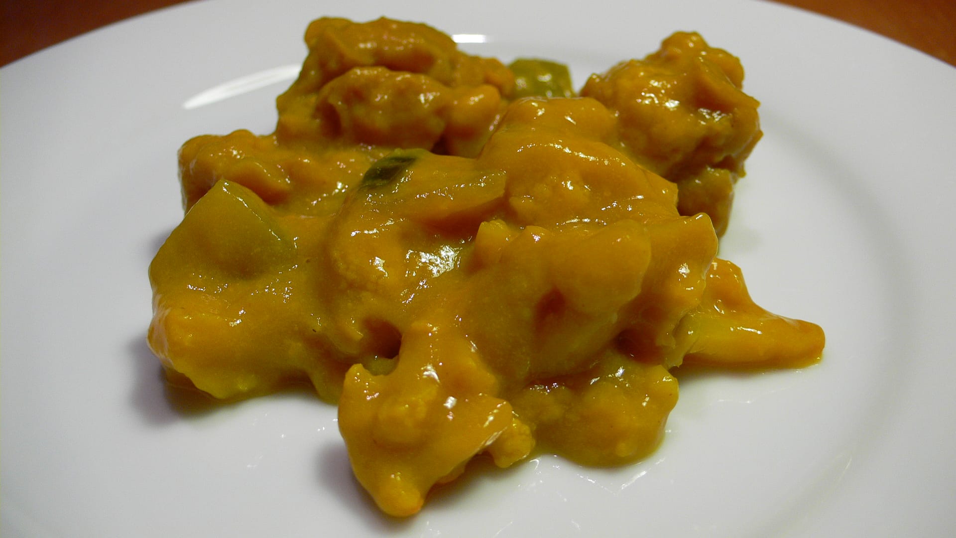 Bright yellow piccalilli on a plate