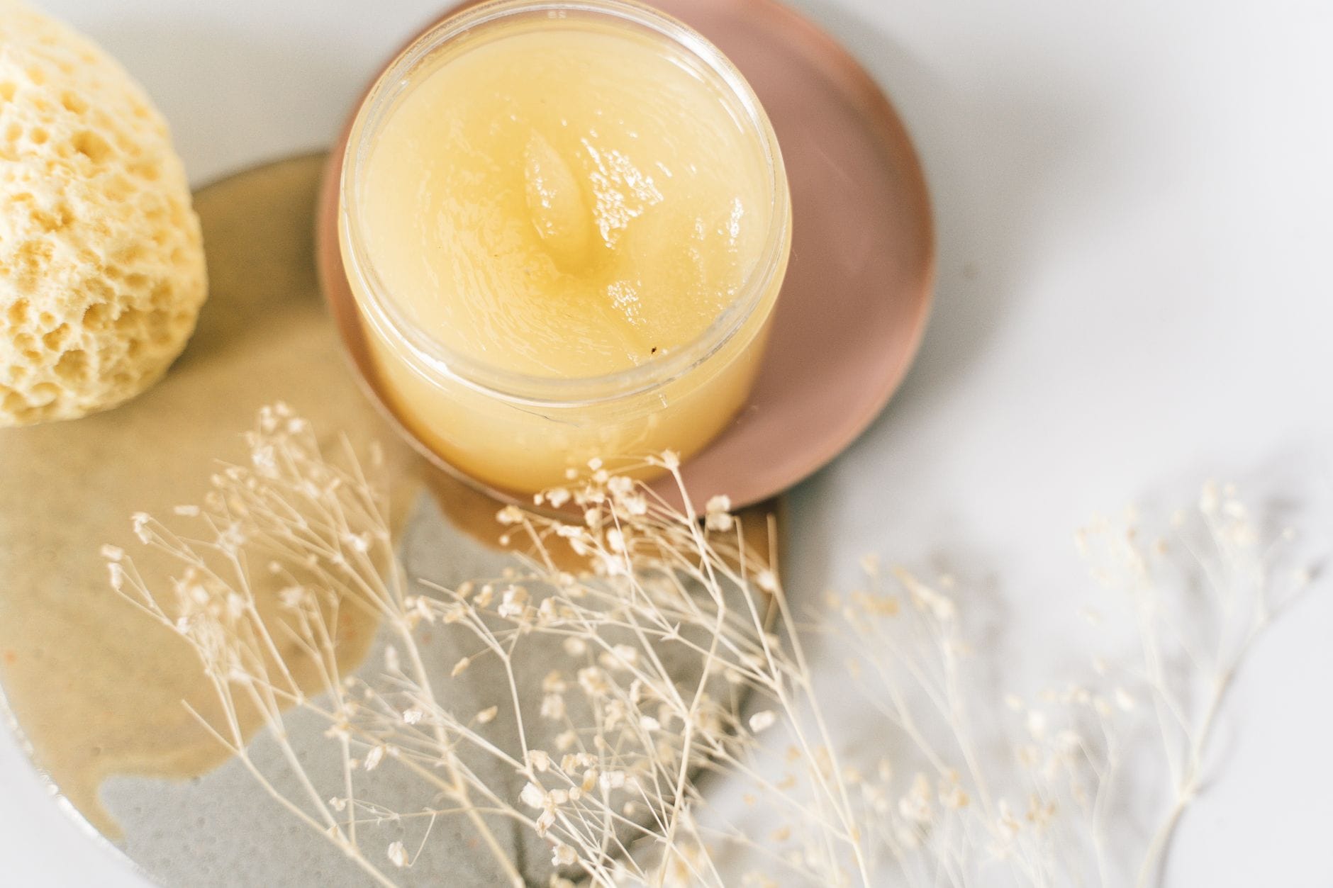 A jar of bright yellow lemon curd