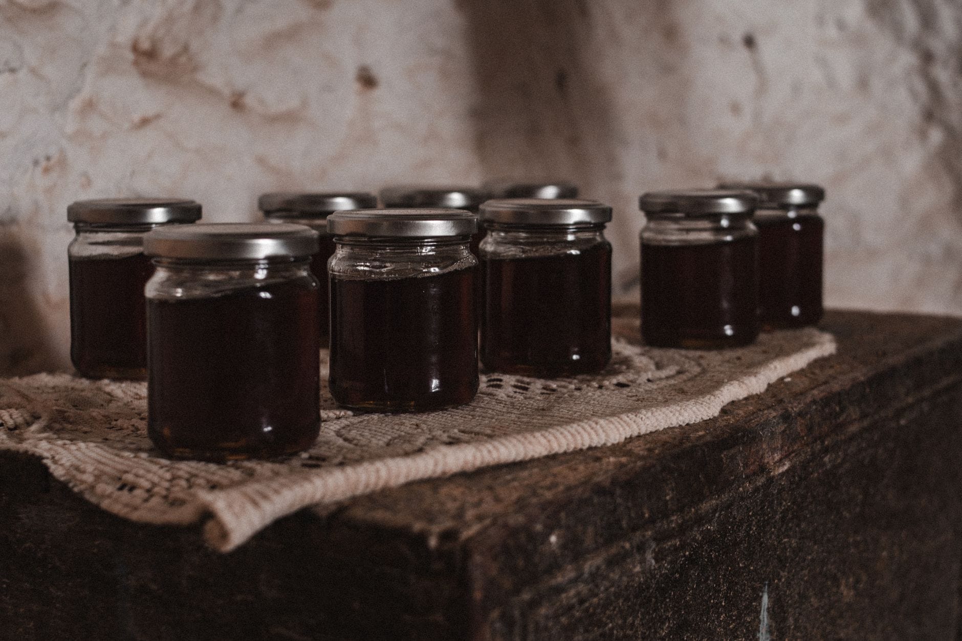 Jars of deep-purple plum jam