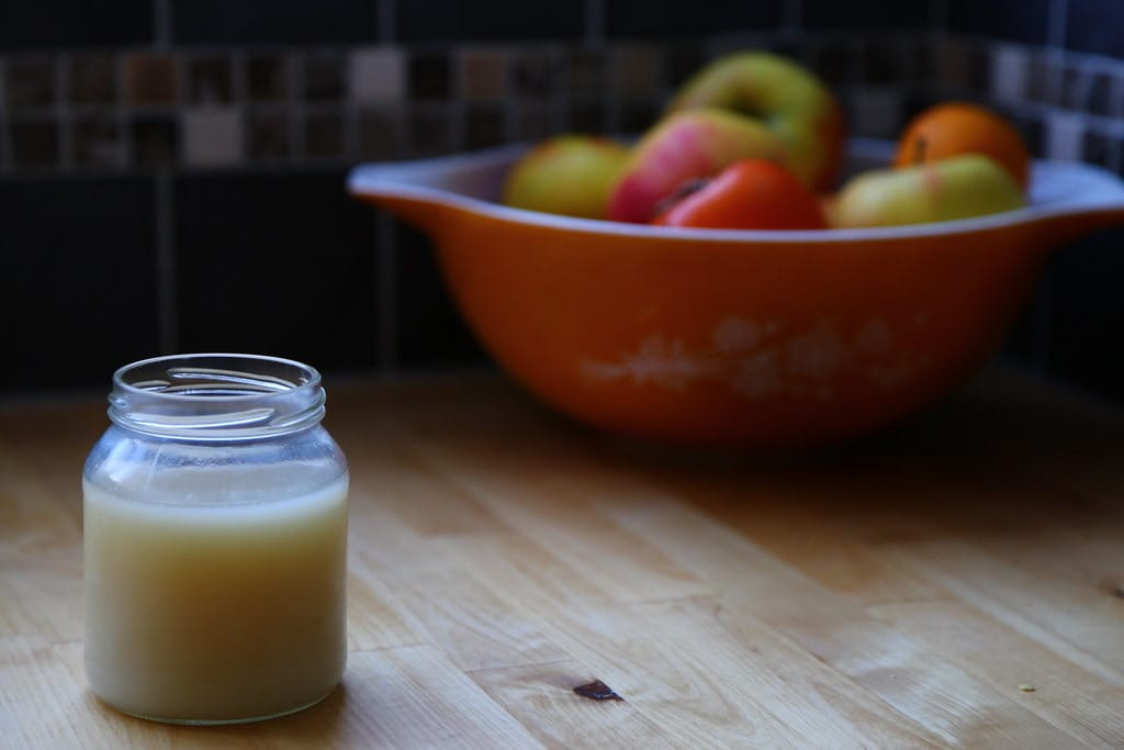 A jar of pale home-rendered beef tallow