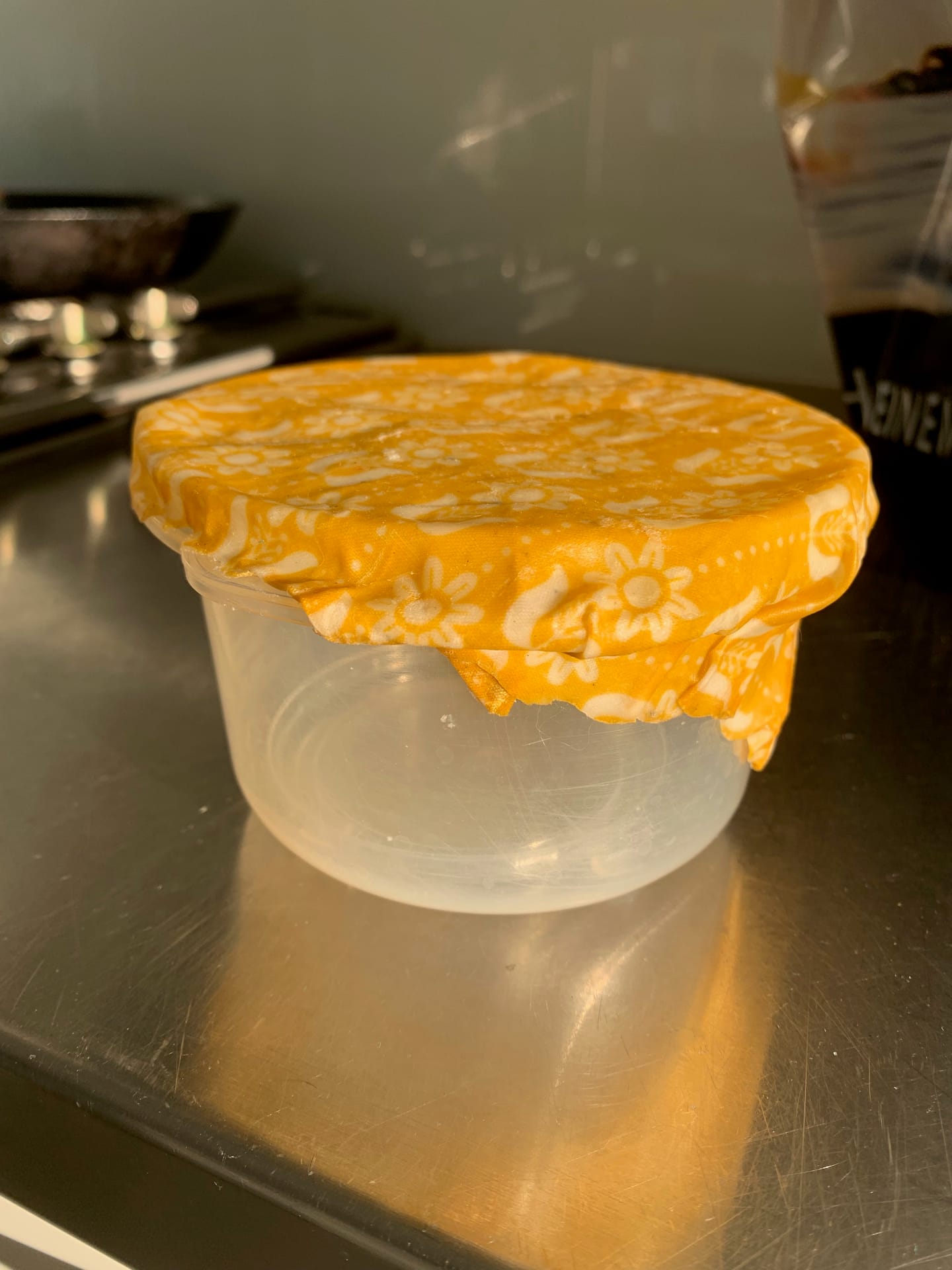 A beeswax wrap sealing a bowl of food