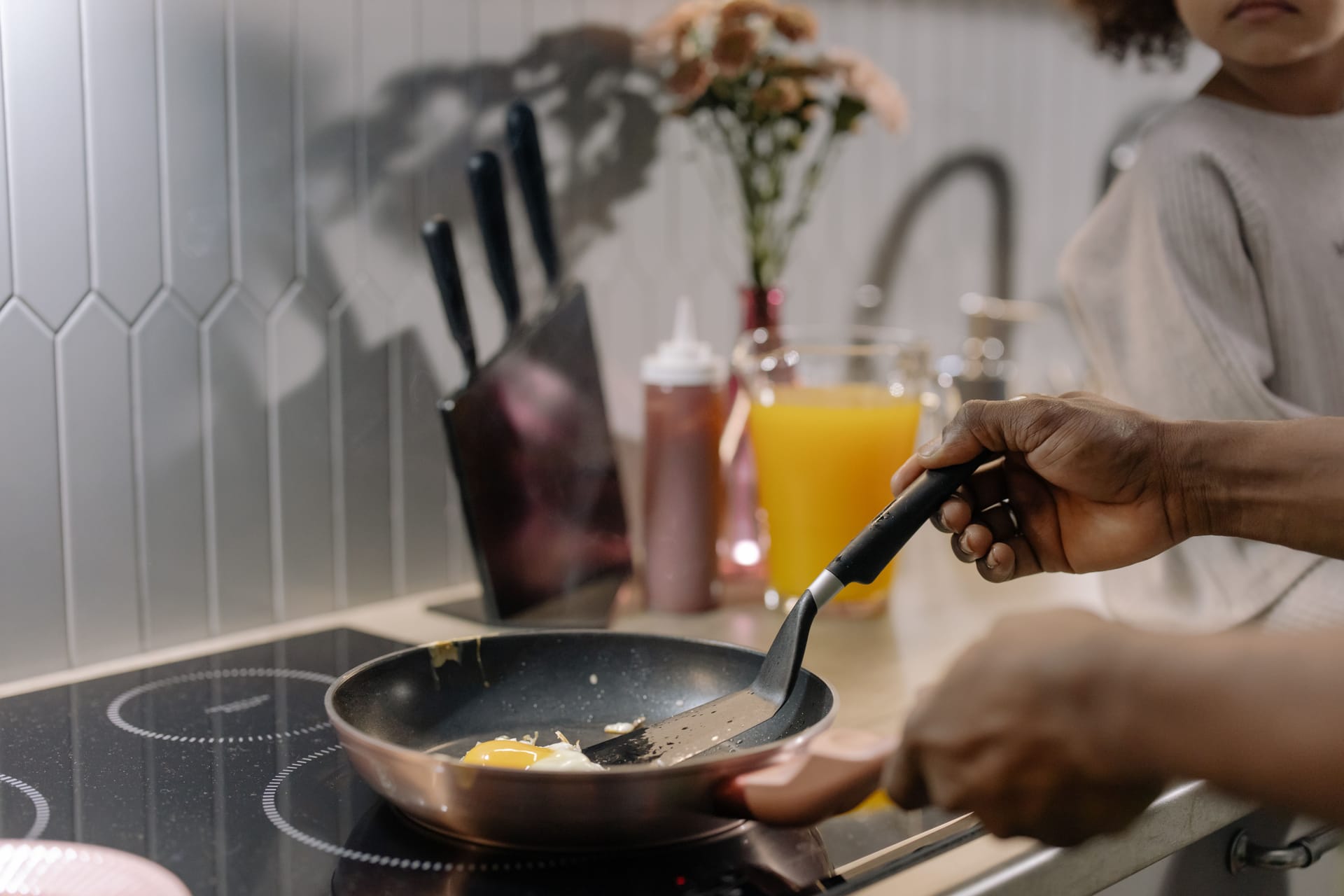 Eggs frying in a pan on a hob