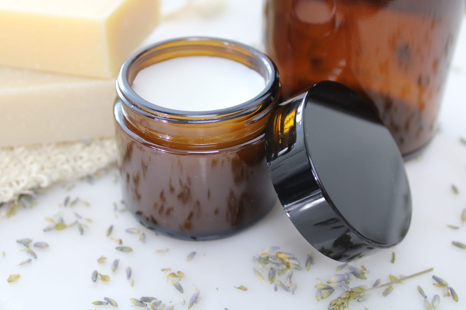 A jar of natural balm with lavender and beeswax