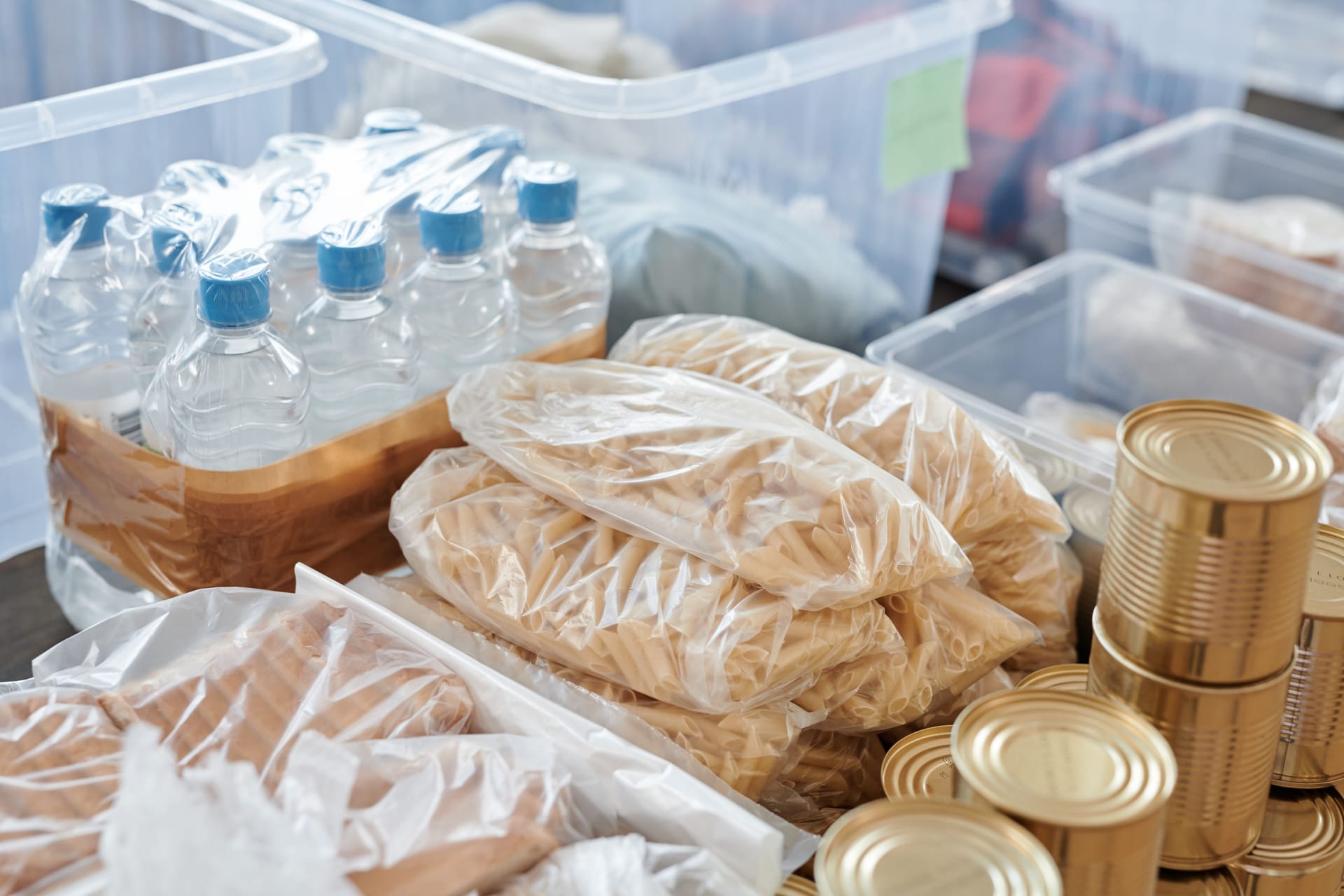 Bottled water, pasta and tins stored for an emergency