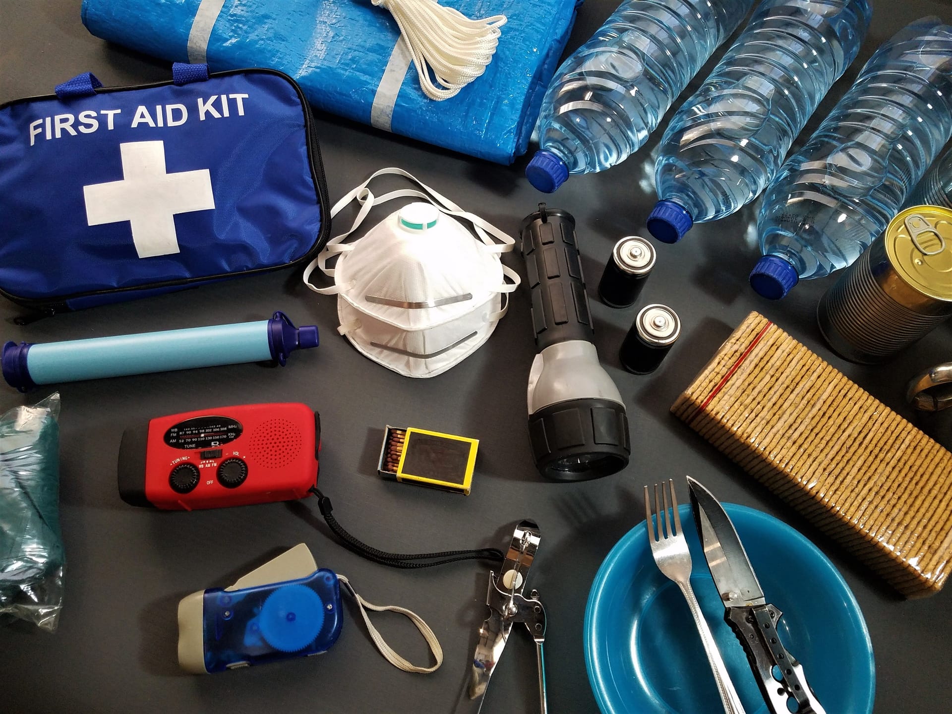 A home emergency kit with first aid, water, a torch and radio