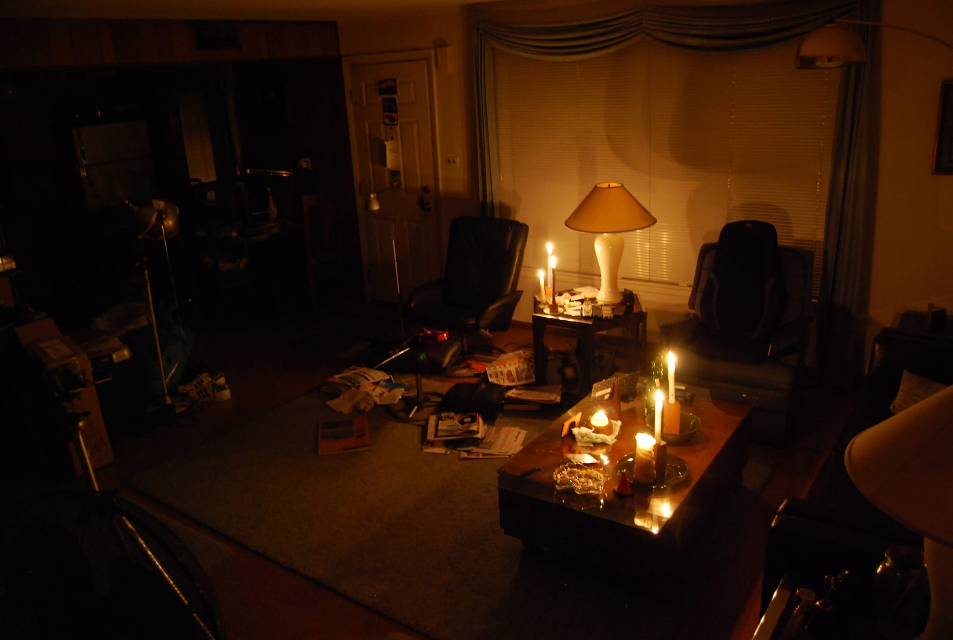 A living room lit by candlelight during a power cut