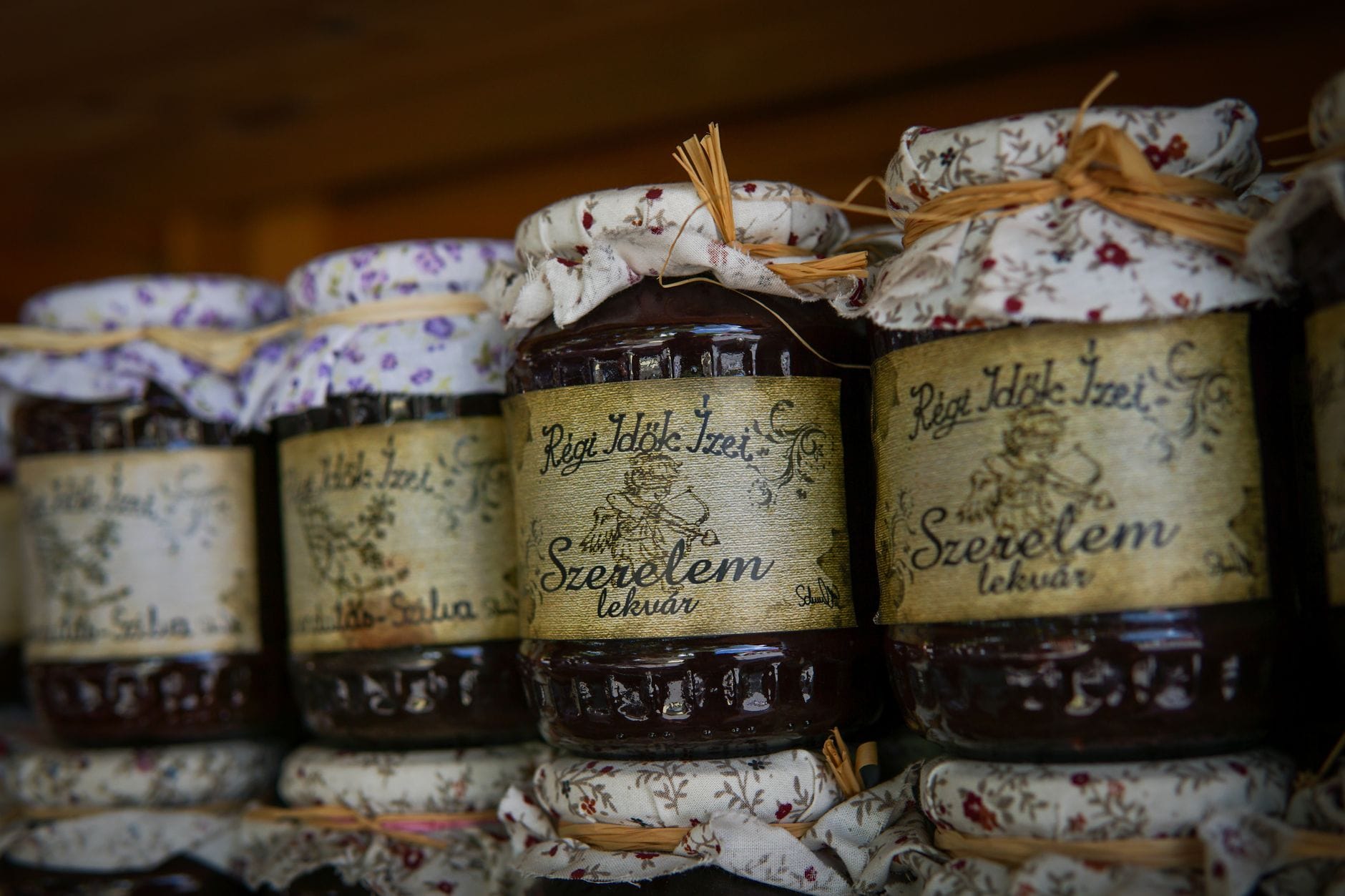 Rows of labelled jars of homemade jam