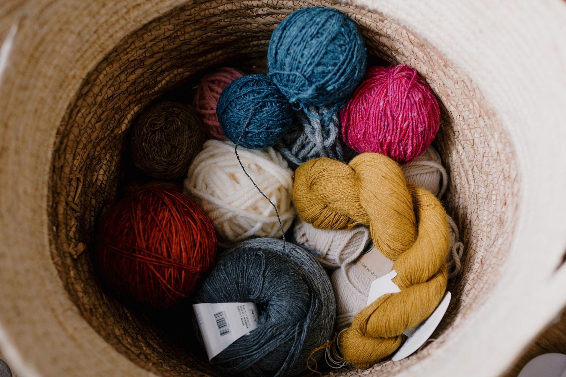 A basket of colourful wool skeins