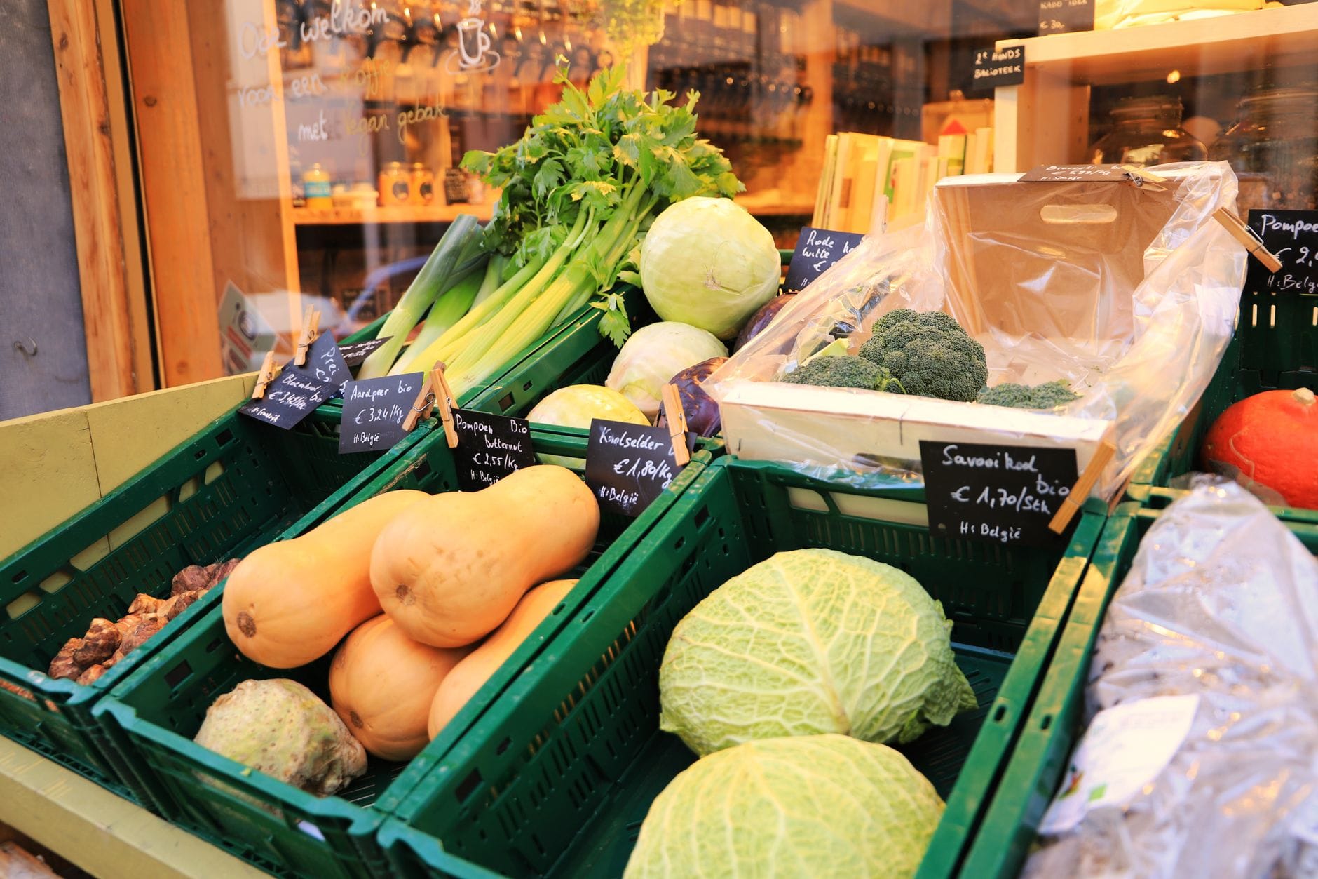A British vegetable display with a price chalkboard