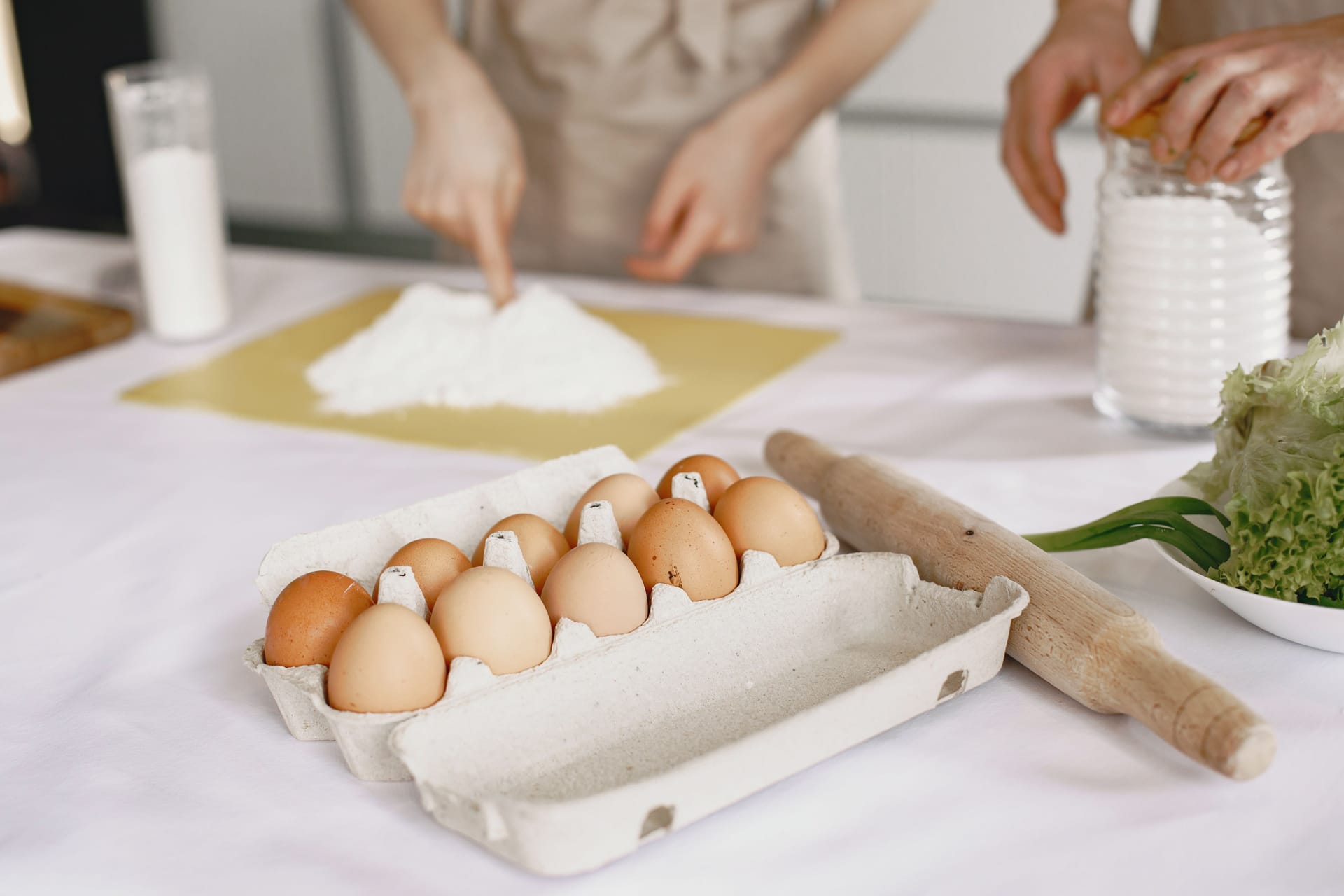 Brown eggs and flour on a kitchen table